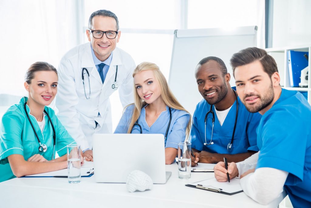 team of doctors and general practitioner having conversation